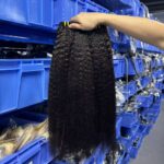 Kinky straight human hair bundles close-up showing double weft construction and natural black color