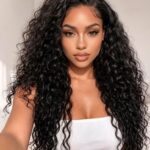 Model wearing hairstyle made from water wave bundles virgin human hair, bouncy wet look curly protective style
