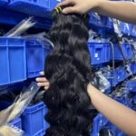 Wholesale Indian wave bundles for salons natural light showing loose wavy texture